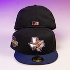 Two Masterpiece WS05 Houston Astros New Era Hat 5950 Fitted caps are shown, one front and one back. The front features a Texas outline with star and globe patch; the back has a small rectangular patch, and both have a dark blue brim.
