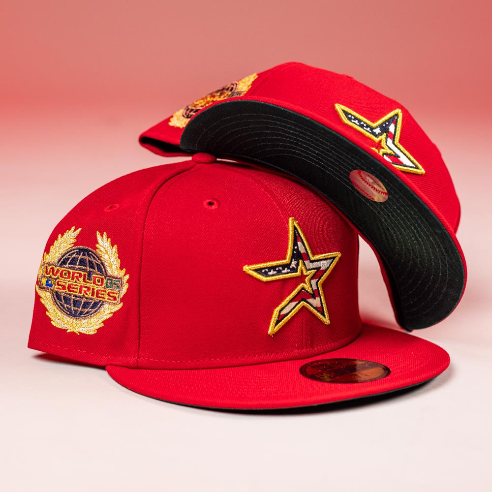 Two Crest Lo 2.0 Houston Astros New Era Hat 5950 Fitted caps are shown—each bright red with embroidered star patches, World Series emblems, and flat brims. One stands upright; the other displays its black underbrim on top.