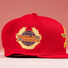 The Crest Lo 2.0 Houston Astros New Era Hat 5950 Fitted by New Era is red, with a gold and blue World Series globe and laurel patch on the side, shown against a pink background.