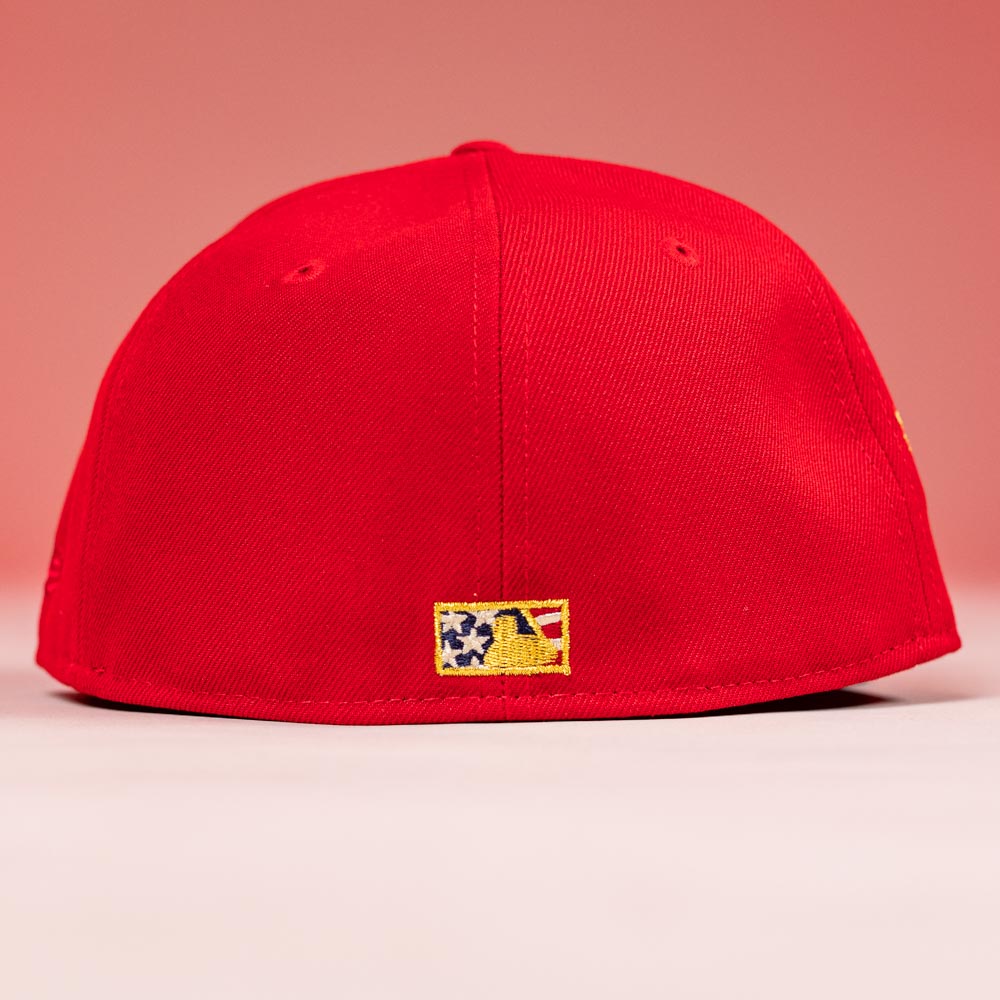 The Crest Lo 2.0 Houston Astros New Era Hat 5950 Fitted is shown from the back on a red background, featuring a small embroidered logo with stars and a yellow baseball outline at the center of the cap.