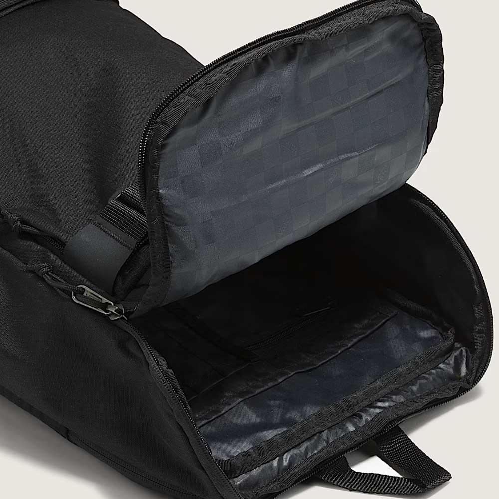 A close-up of the Obstacle Skatepack Backpack VN0A3I696ZC1 Black Ripstop by Vans Skateboarding shows its spacious main compartment, zippered closure, and checker-patterned lining inside the top flap.