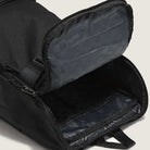 A close-up of the Obstacle Skatepack Backpack VN0A3I696ZC1 Black Ripstop by Vans Skateboarding shows its spacious main compartment, zippered closure, and checker-patterned lining inside the top flap.
