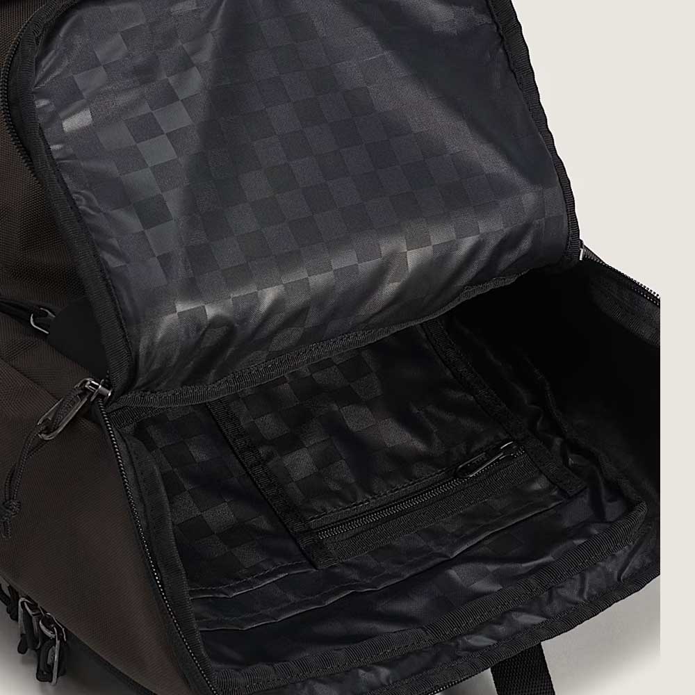 A close-up of the Obstacle Skatepack Backpack VN0A3I69OVB1 Brown Ripstop by Vans Skateboarding, showcasing its spacious, checkerboard-lined interior and zippered inner pocket.
