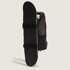 The Obstacle Skatepack Backpack VN0A3I69OVB1 in Brown Ripstop by Vans Skateboarding features a vertical skateboard holder with two horizontal straps and a laptop compartment, shown against a plain light background.