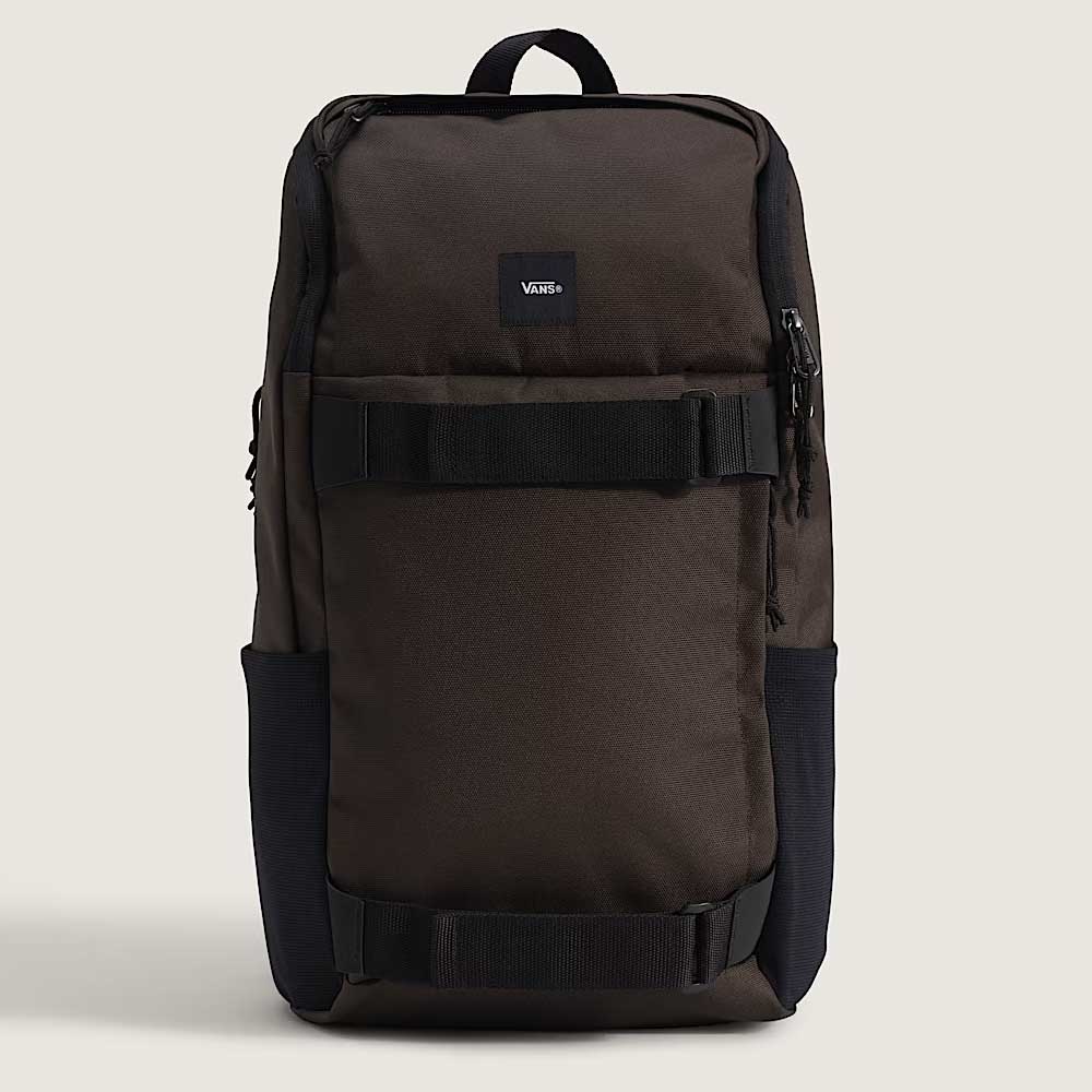 A brown ripstop Obstacle Skatepack Backpack VN0A3I69OVB1 from Vans Skateboarding, featuring a rectangular shape, top handle, front zipper pocket, two horizontal front straps, and a laptop compartment, shown on a plain light background.