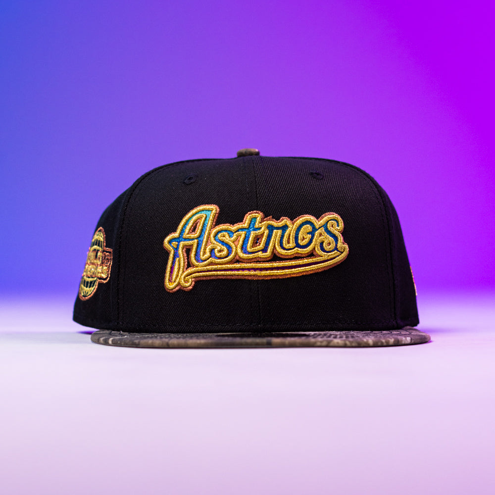 The Oil Spill WS05 Houston Astros New Era Hat 5950 Fitted features gold and yellow Astros embroidery on black, showcased on a flat surface with a purple gradient background—ideal for any Houston Astros fan.