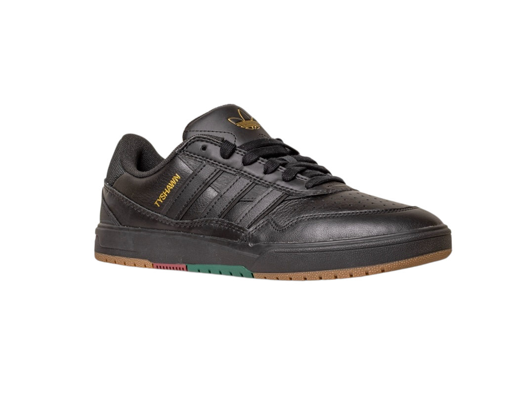 The Tyshawn 2 II Adidas Skateboarding Core Black Core Green Leather Shoes feature black laces, gold branding, a gum-colored sole with green and red accents, and perforated detailing on the toe and side stripes.