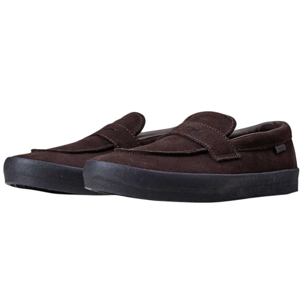The Skate Loafer Vans VN000VA6Y491 Brown Black Suede Skateboarding Shoes feature slip-on styling, black rubber soles for enhanced grip, and are shown from a front-side angle on a white background.