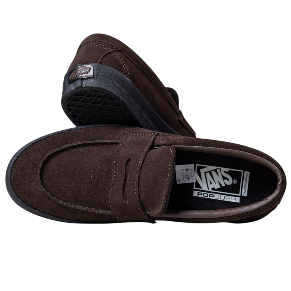 A pair of Skate Loafer Vans VN000VA6Y491 Brown Black Suede Skateboarding Shoes, one flat and one on its side revealing the sole’s grip, heel logo, visible interior Vans branding, and PopCush label for impact protection.