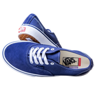 A pair of Skate Authentic Deep Twilight Vans VN000EEREMT1 suede white skateboarding shoes—one lies on its side showing the insole logo, the other propped up to display the gum outsole and red Vans heel tag.