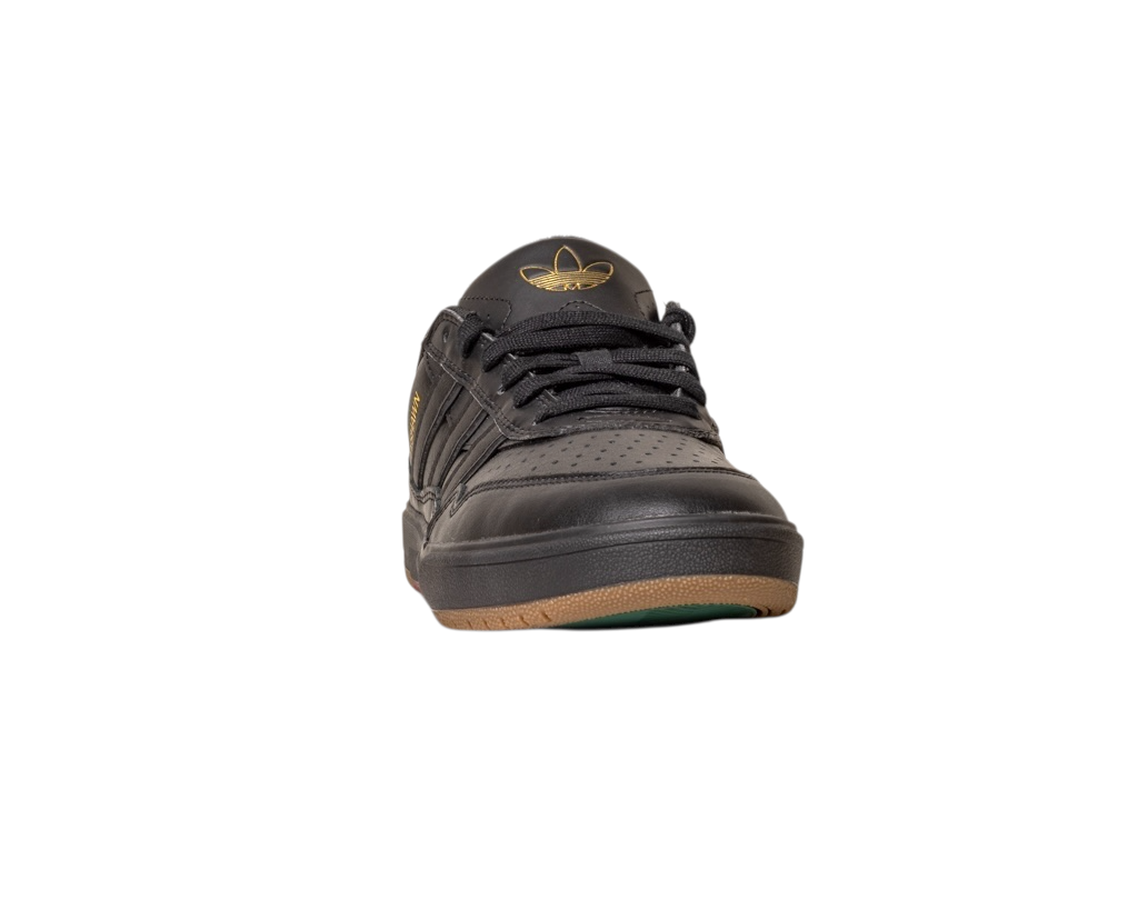 The Tyshawn 2 II Adidas Skateboarding Core Black Core Green Leather Shoe is shown from the front against a white background, featuring a gold logo, brown rubber sole, and perforated toe box.