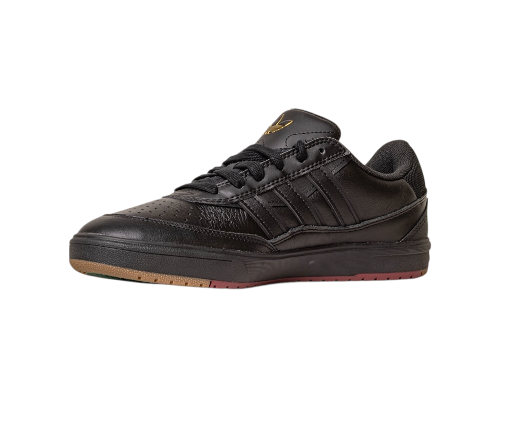 The Tyshawn 2 II Adidas Skateboarding Core Black/Core Green Leather Shoes feature a textured sole, perforated toe box, black laces, subtle gold logo on the tongue, signature side stripes, and a slightly raised heel for classic skate style.