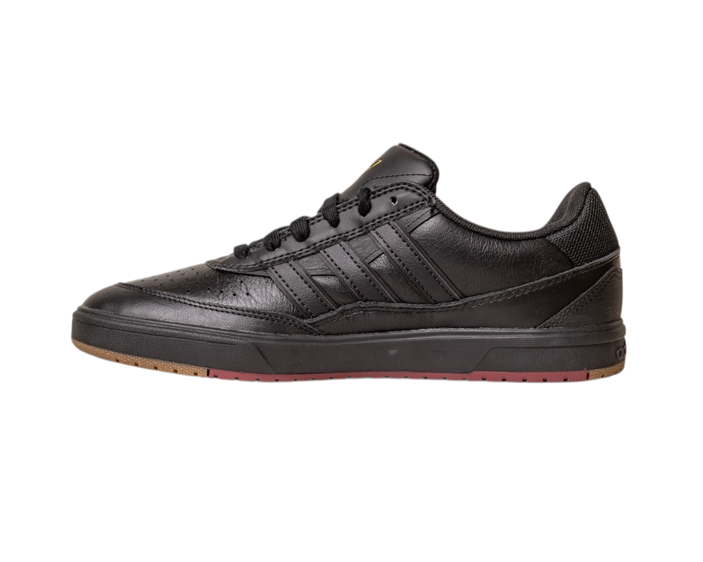 The Tyshawn 2 II Adidas Skateboarding Core Black/Core Green Leather Shoes feature black laces, a perforated toe, three black side stripes, a low-ankle design, and a mostly black sole with touches of brown and red at the front.