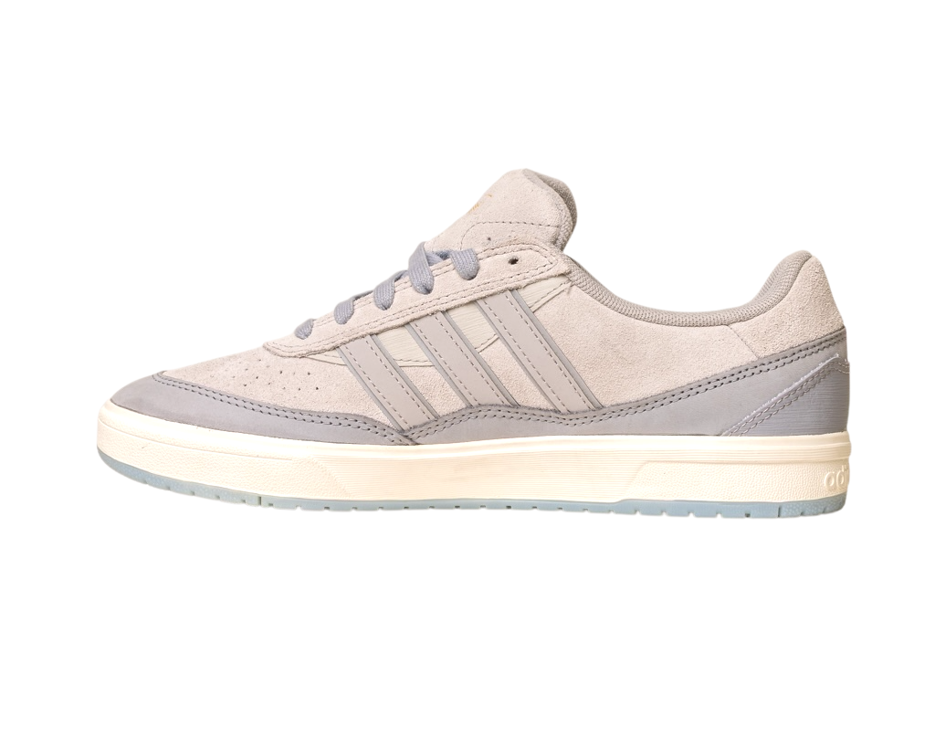 The JI0848 Granite White Tyshawn 2 II Adidas Skateboarding Shoe, shown from the side on a white background, features light gray suede, three side stripes, a white midsole, and a light gray outsole.