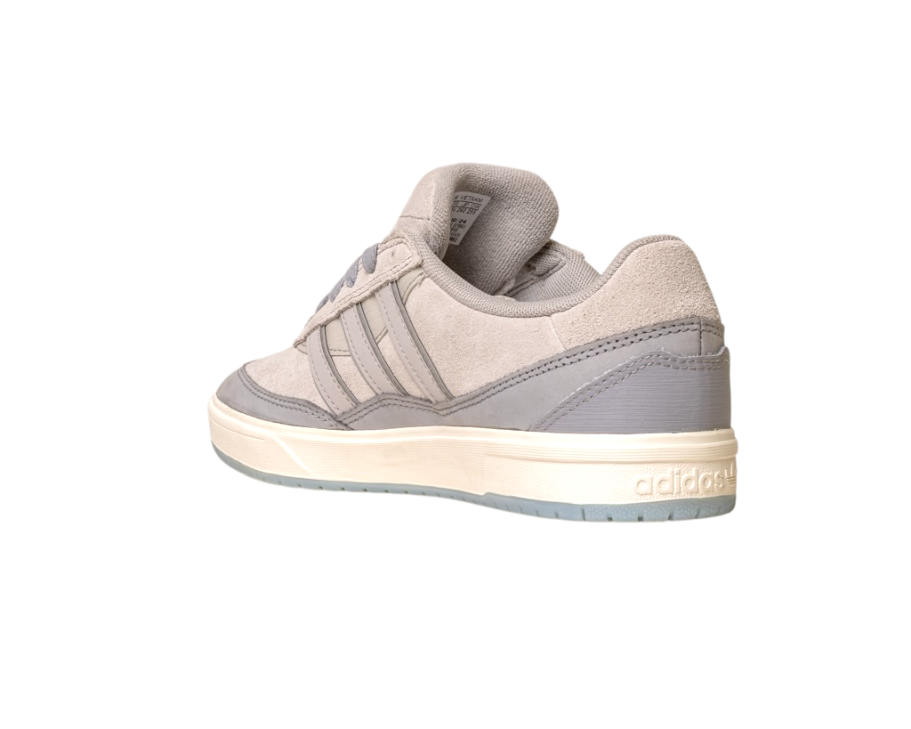 The JI0848 Granite White Tyshawn 2 II Adidas Skateboarding Shoes feature light gray suede and leather-like textures, three side stripes, and a white sole. Inspired by Tyshawn II, they blend style and performance, shown at an angle on a white background.