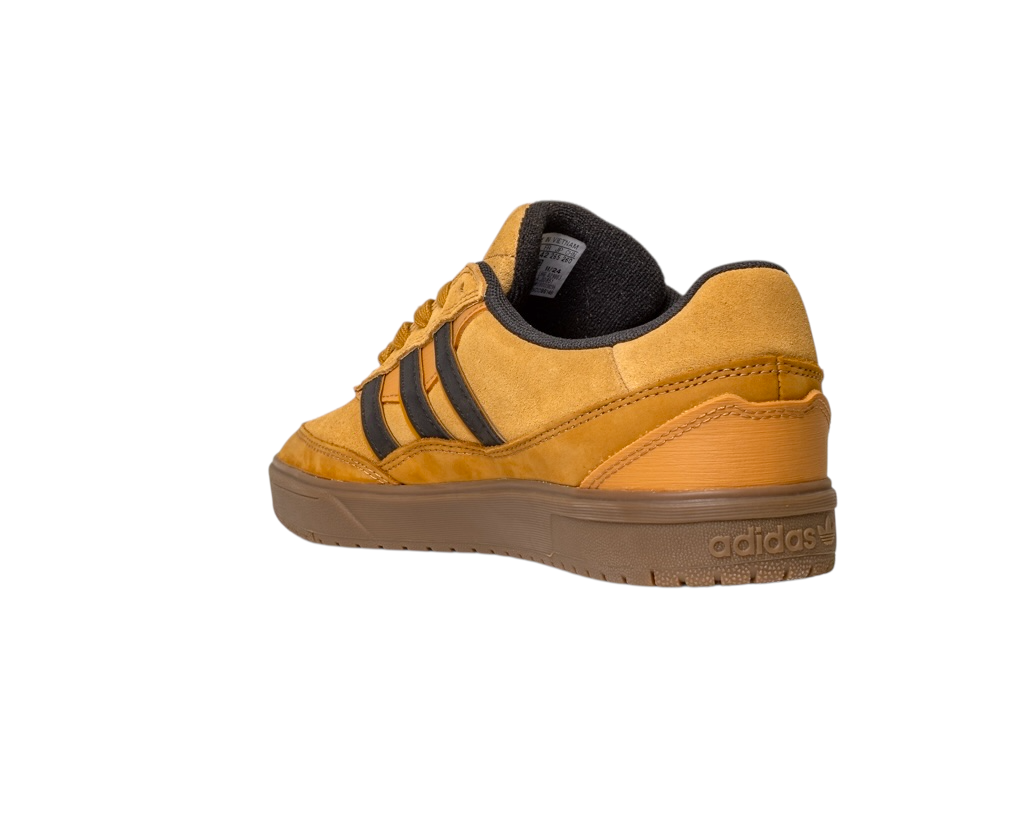 A back-left view of the JI0851 Mesa Black Gum Tyshawn 2 II Adidas Leather Suede Skateboarding Shoes, yellow and brown with black stripes, cupsole construction, isolated on a white background.