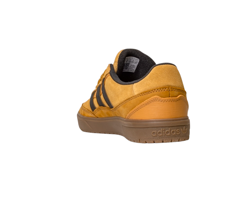 The JI0851 Mesa Black Gum Tyshawn II Adidas Leather Suede Skateboarding Shoe features yellow suede, black stripes, and a brown rubber cupsole, shown from the back/side on a white background, inspired by adidas skateboarding style.