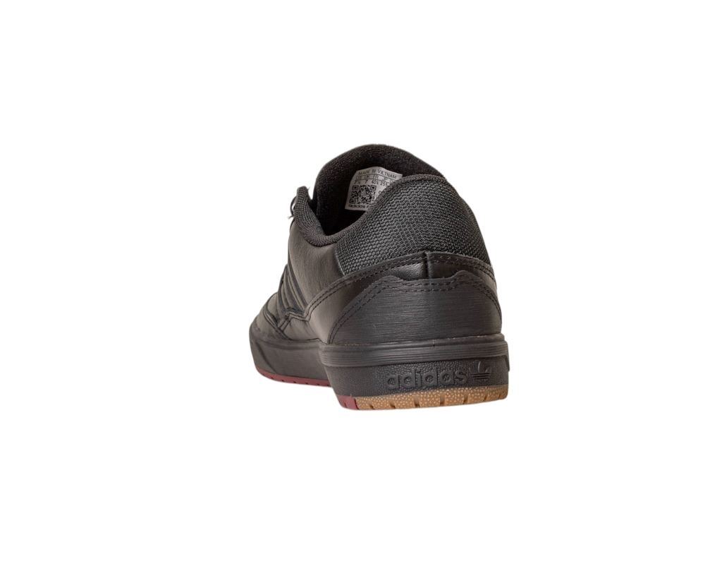 The Tyshawn 2 II Adidas Skateboarding Leather Shoe in Core Black and Core Green is shown from the back, highlighting the heel, sole, and Adidas logo against a plain white background.