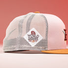The Anglera 17WS Pink Trucker Houston Astros New Era 5950 Fitted features a pink and white mesh design, gold brim, and a diamond patch reading WORLD SERIES 2005 2017—an ideal pick for Astros fans.