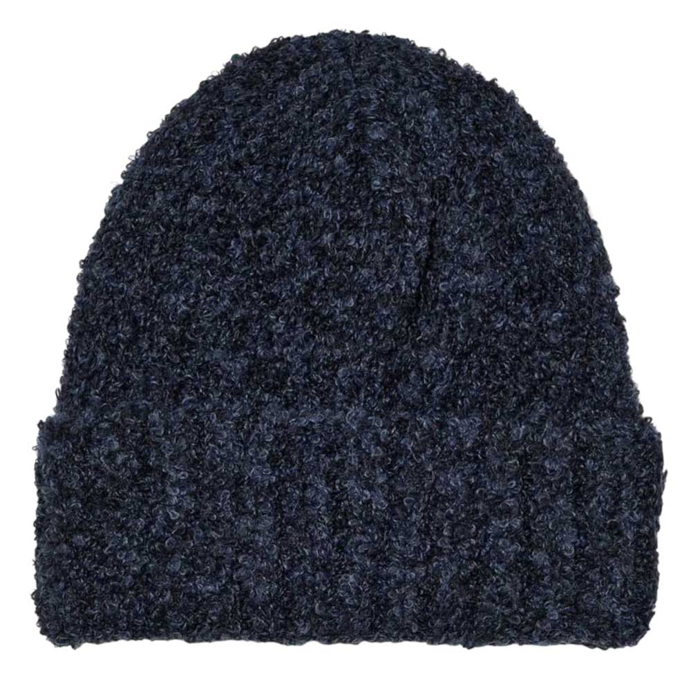 The Polar Beanie Fluff Navy is a dark blue, textured knit hat made from soft teddy yarn, featuring a folded brim and loose fit, shown on a white background.