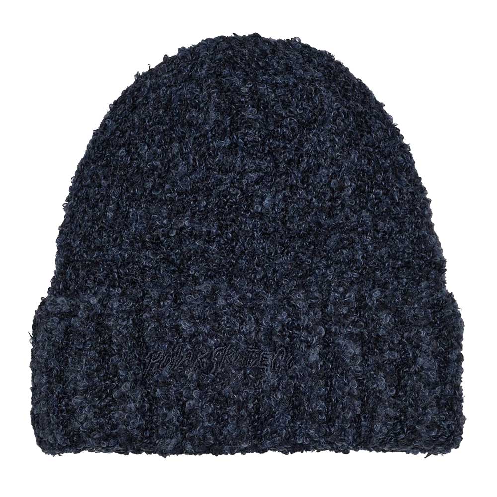 The Polar Beanie Fluff Navy features dark blue boucle knit with a fuzzy teddy yarn texture and a wide ribbed fold-up brim, displayed against a white background.