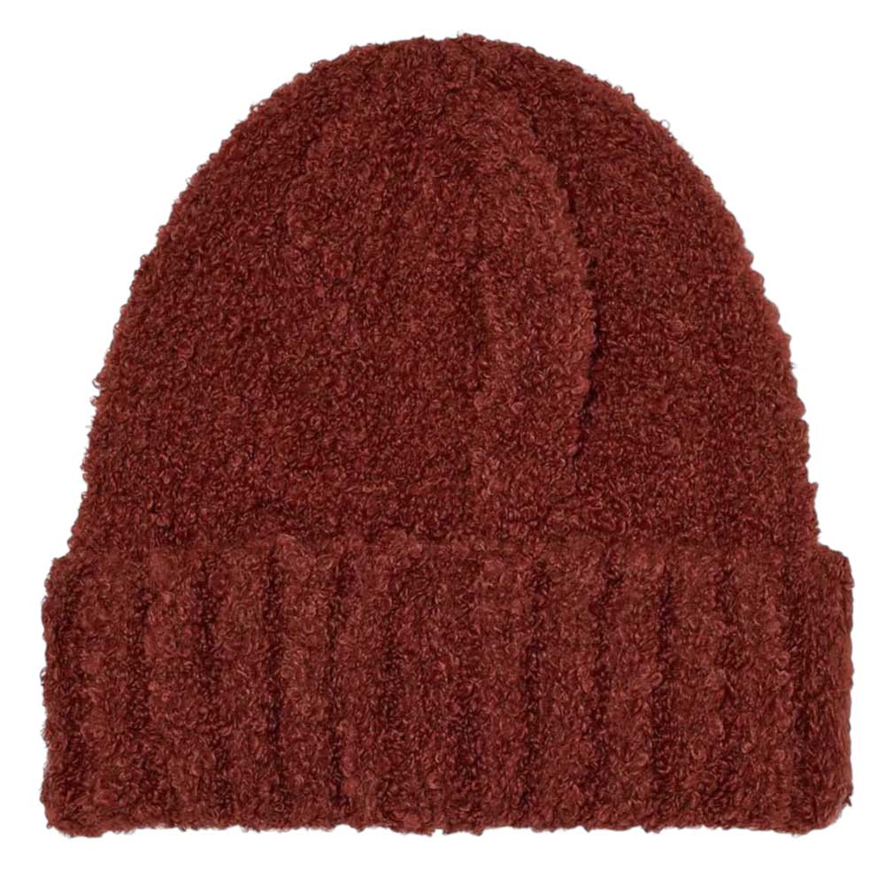 The Polar Beanie Fluff Rust is a deep red knit beanie with a folded brim, crafted from soft teddy yarn and shown on a plain white background.