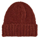 The Polar Beanie Fluff Rust is a deep red knit beanie with a folded brim, crafted from soft teddy yarn and shown on a plain white background.