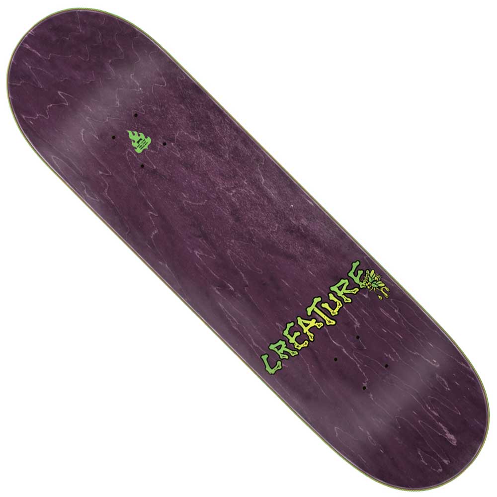 The Provost Skull Spider Pro 8.47in x 31.98in Creature Skateboard Deck features a wood grain purple finish, a small green creature logo at the top, and bold green CREATURE lettering with yellow detail near the bottom right.