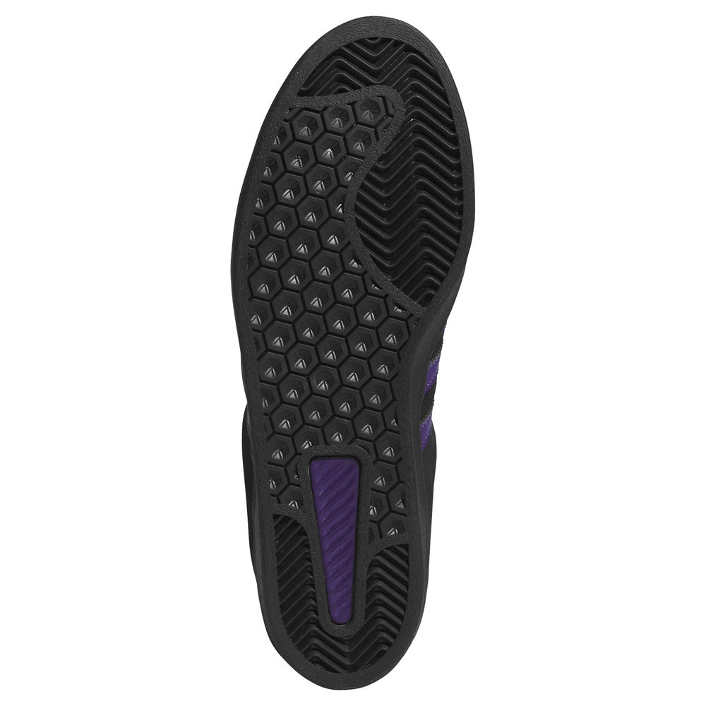 The Purple Black KK0247 Campus ADV Adidas Skateboarding Suede Leather Shoes feature a black sole with a hexagonal tread pattern, highlighted by a purple insert near the heel and additional purple accents in the midfoot area. Inspired by classic Campus ADV skate shoes, this textured sole is built for excellent grip and durability, providing varied grip zones ideal for skateboarding performance.