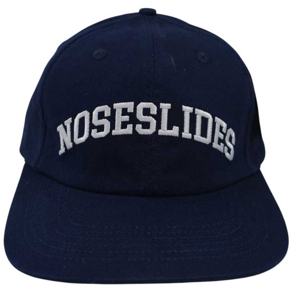 The Quartersnacks Hat Noseslides Navy features NOSESLIDES embroidered in bold white letters on the front—an essential cap for streetwear fans.