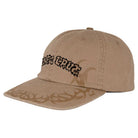 The Razor Arch Strip Hat Tan Snapback by Independent Skateboards is an unstructured, low-profile beige cap with black text and dark brown tribal patterns on the brim and front panels. OS design suits all.
