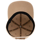Top view of the tan Razor Arch Strip Hat, an unstructured snapback by Independent Skateboards. Features include a black sweatband, black inside seam text, and a low-profile fit. Unisex, OS.