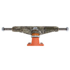 A front view of the Realtree APX INDY 144 Standard Stage 11 Trucks Set of TWO showcases their distinctive orange baseplate and camouflage-patterned hanger, emphasizing the signature design of these skateboard trucks.