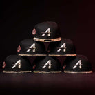 Six Pre-Order Red Dot Red City Connect Houston Astros New Era 5950 Fitted hats are stacked in a pyramid against a dark background, ready for in-store pick-up or pre-order.