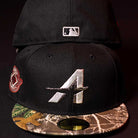 The Pre-Order Red Dot Red City Connect Houston Astros New Era 5950 Fitted hat features a silver A logo front, camo brim, white MLB logo back, and red side patch. Available for in-store pick-up or order fulfillment.