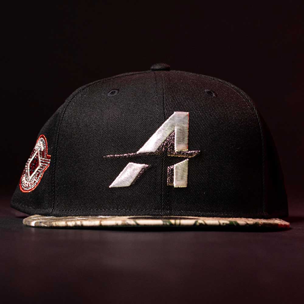 The Pre-Order Red Dot Red City Connect Houston Astros New Era 5950 Fitted Hat features a black base, silver A logo on front, patterned brim, and red/white patch on the side. Available for pre-order with convenient in-store pick-up options.