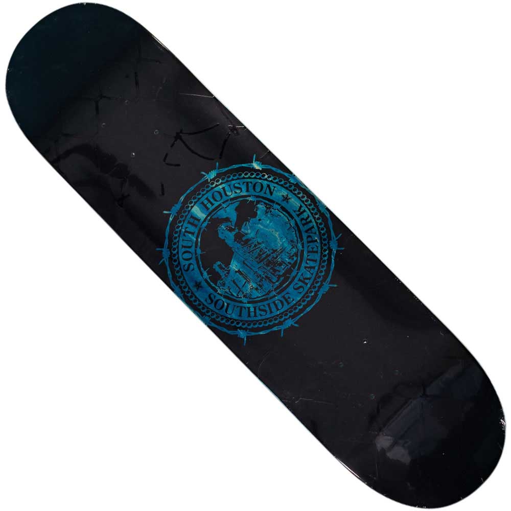 The Refinery Southside Skateboard Deck by Bigo features a black chain link fence design with a blue circular Southside Skatepark logo, cityscape, and barbed wire at the center.