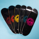 Six Refinery Southside Skateboard Decks by Bigo, including the chain link fence design, each with colored logos (red, orange, yellow, green, blue, pink), are fanned out on a light blue background.