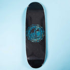 The Refinery Southside Skateboard EGG Deck by Bigo features a black stained veneer, blue center graphic with text, subtle Southside Skatepark inspiration, and a rectangular shape with rounded ends on a light blue background.