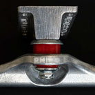 Close-up of a Rhino Span Polished Silver Standard INDY 169 Stage 11 Truck with a red bushing and "RHINO" engraved on metal, sold as a set of two, shown against a black background.