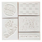 The SC Stamp Set Natural OS Unisex by Santa Cruz includes five white rubber stamps on a wooden block with unique designs, perfect for fans of skateboarding apparel and Santa Cruz Skateboards.