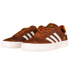 The Brown White Gold Gazelle ADV HQ7547 Adidas Skateboarding Suede Shoes feature brown leather, white rubber soles, three white stripes, brown laces, and a gold logo by the heel—classic Gazelle ADV style.