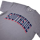 Granite gray Southside The Glide T-Shirt featuring SOUTHSIDE printed in arched, navy-blue collegiate lettering with red and light blue outlines.