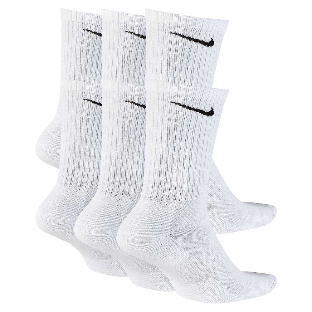 Six pairs of white Nike SB crew socks (style SX7666100) with black swoosh logos are displayed in a staggered, overlapping arrangement on a plain white background.