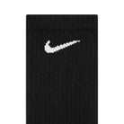 Close-up of black fabric with a white Nike swoosh embroidered, highlighting the comfort of SX7666964 Multi-Color Black Nike SB Crew Socks 6 Pack in heather gray, white, and black.
