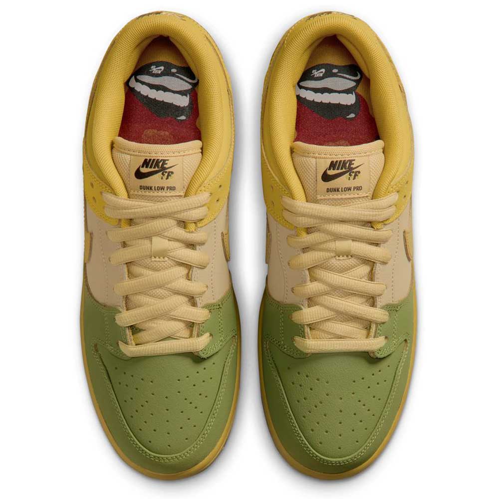 A pair of Nike SB Skateboarding Shoes, the Saffron Quartz Pear Hatch Chili Dunk Low Pro IO0427300, featuring green and yellow color blocking, tan laces, and custom insoles with a graphic of a smiling character wearing a hat. This classic basketball-inspired sneaker is shown from an overhead view.