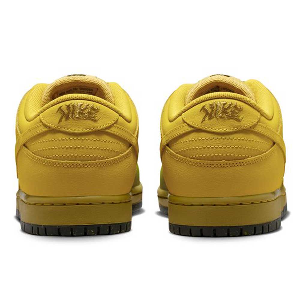 Back view of the Saffron Quartz Pear Hatch Chili Dunk Low Pro IO0427300 Nike SB Skateboarding Shoes, yellow low-tops with black soles and bold embroidered tiger graphics on the heels, reminiscent of the classic Dunk Low style.