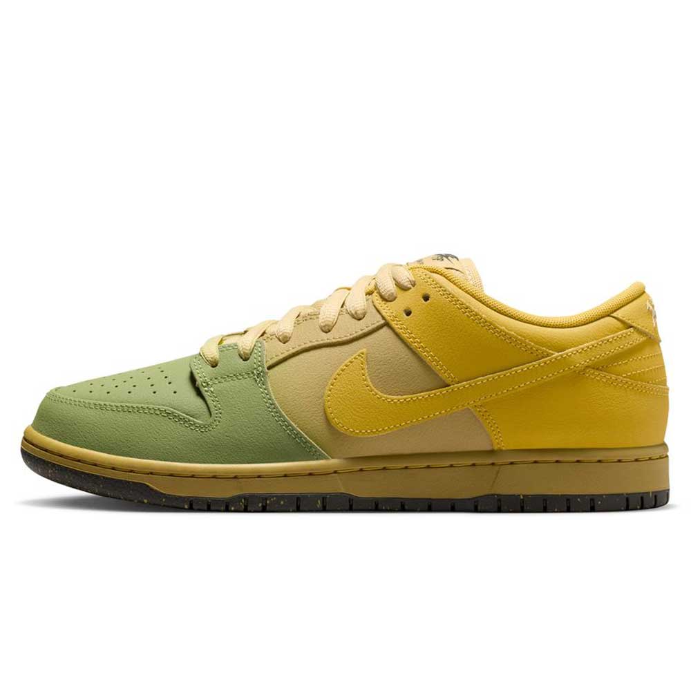 Side view of the Saffron Quartz Pear Hatch Chili Dunk Low Pro IO0427300 Nike SB Skateboarding Shoe, showcasing a green toe, beige midsection, and vibrant yellow heel, Swoosh, and laces. The black outsole pairs with a contrasting yellow midsole for added boldness.