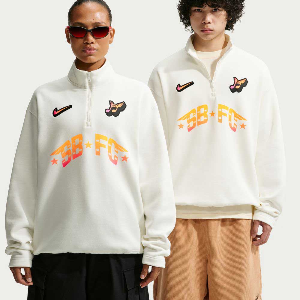 Two models wear Sail IM5463133 Skate 1/2 Zip Fleece Crew Nike SB tops with colorful graphics and logos. One wears sunglasses; both stand against a plain background. These fleece crews are easy to machine wash.