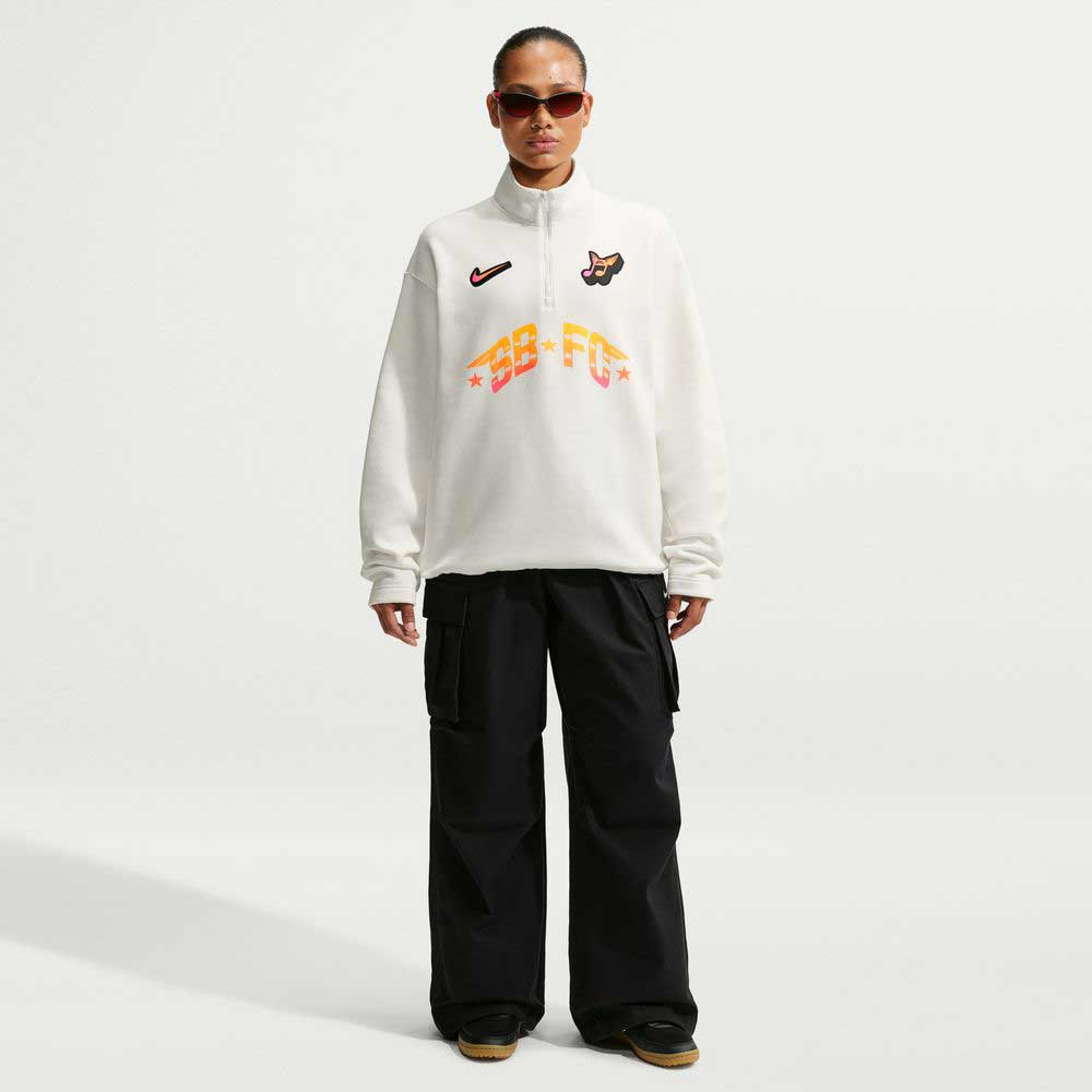 A person stands facing forward against a plain light background, wearing sunglasses and the Nike SB Skateboarding Sail IM5463133 Skate 1/2 Zip Fleece Crew, imported and designed for easy machine wash care.